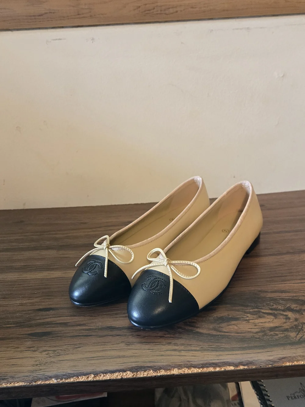 Chanel Two-Tone Leather Cap-Toe Ballet Flats in Beige & Black